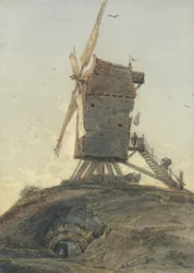 Molino de viento en una colina en un paisaje